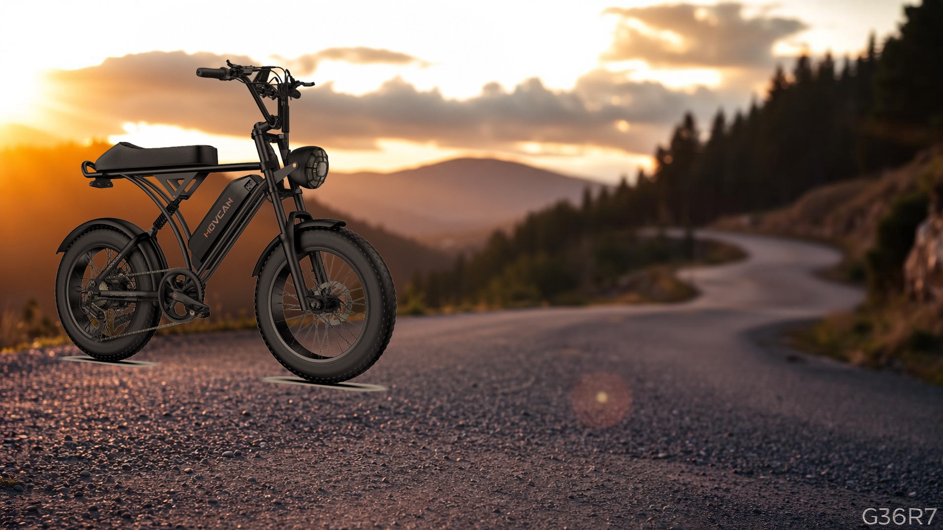 Moped-style fat-tire electric bike on a winding mountain road at golden hour